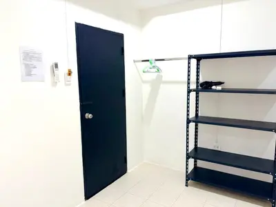 a room with a black door and a shelf at Patong Canal Villa 103 in Patong Beach