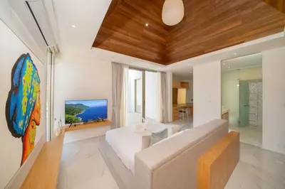 a living room with a couch and a table at Near Laguna 4 BR morden pool villa V9 in Ban Pak Lak