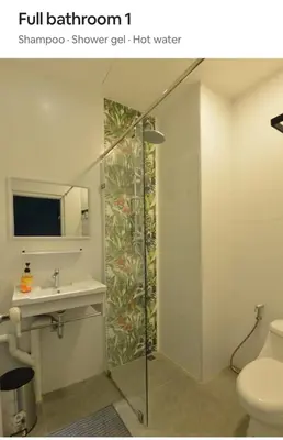 a bathroom with a shower stall and a sink at New Five Star Home- Patong Beach in Patong Beach