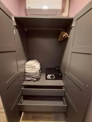 a walk in closet with stairs leading to a door at New Five Star Home- Patong Beach in Patong Beach