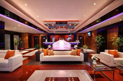 a lobby with white couches and a fountain at Studio Bangla Suite 304 in Patong Beach