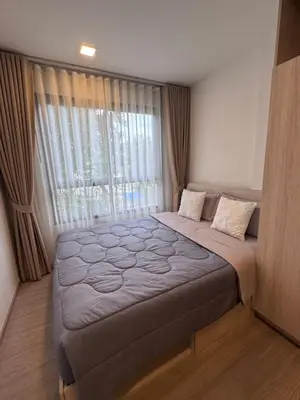 a bedroom with a large bed with a window at DCondo Kathu ใกล้หาดป่าตอง in Kathu