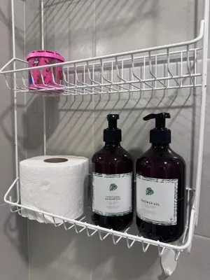 a rack with two bottles and a roll of toilet paper at DCondo Kathu ใกล้หาดป่าตอง in Kathu