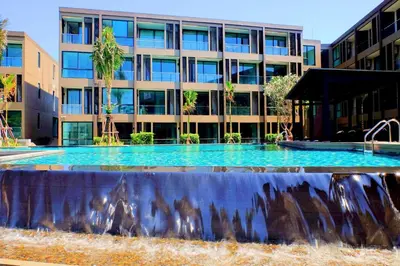 a large fountain in front of a building at Seaview At Cape Panwa in Panwa Beach