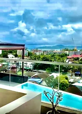 a view of a city from the balcony of a building at Patong Duplex Penthouse with Sea View in Patong Beach
