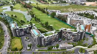 an aerial view of a city with buildings and a river at Magnificent apartments in Laguna in Laguna Phuket