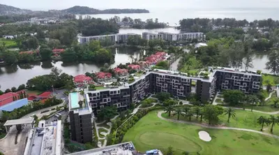 an aerial view of a resort next to a body of water at Magnificent apartments in Laguna in Laguna Phuket