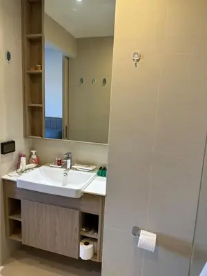 a bathroom with a sink and a mirror at Magnificent apartments in Laguna in Laguna Phuket