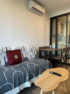 a living room with a bed and a table at Magnificent apartments in Laguna in Laguna Phuket