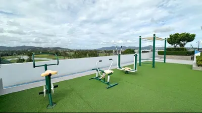 a gym on the roof of a building at Magnificent apartments in Laguna in Laguna Phuket