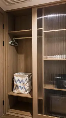 a closet with a pillow sitting on a shelf at Laya Resort - Forest View Studio in Layan Beach
