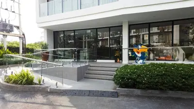 a building with a statue in front of it at Laya Resort - Forest View Studio in Layan Beach
