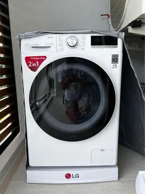 a white washing machine sitting in a room at Title V - 1 br Bamboo Rawai Apartment in Karon Beach