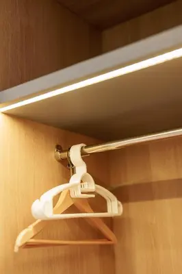 a light hanging from a door with a hanger at Beachfront 1524 Wyndham Gardens Condo Naithon in Phuket Town