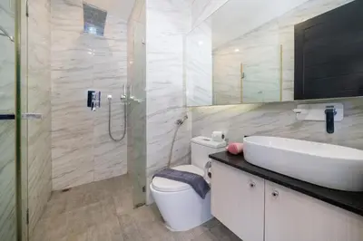 a bathroom with a toilet and a sink and a shower at Studio Apt Seaview Balcony - Oceana C63 in Kamala Beach