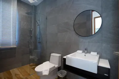 a bathroom with a toilet and a sink and a mirror at Phang nga Villas Private Pool & Tropical Retreats