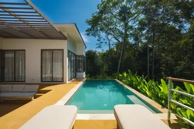 a swimming pool in the backyard of a house at Phang nga Villas Private Pool & Tropical Retreats