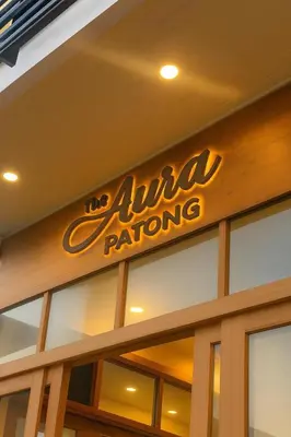 a sign on the side of a pizza restaurant at The Aura Patong in Patong Beach