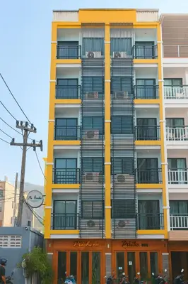 a tall building with balconies on the side of it at The Aura Patong in Patong Beach