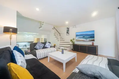 a living room with a couch and a table at Chill Beach Bangla comfy bed and pool 3 bedrooms 10pax in Patong Beach