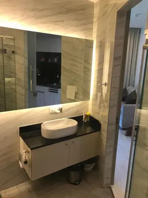 a bathroom with a sink and a large mirror at OCEANA Kamala SeaviewCondo B41 in Kamala Beach
