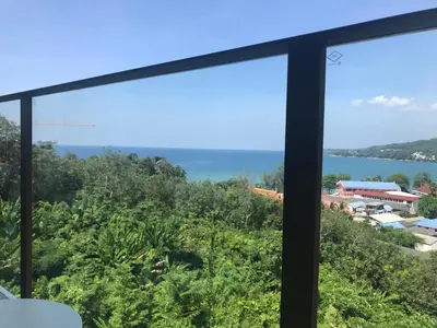 a view of the ocean from a room with a window at OCEANA Kamala SeaviewCondo B41 in Kamala Beach