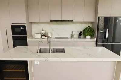 a white kitchen with a sink and a refrigerator at Phuket luxury Asherah villa Bang Tao in Ban Phru Champa