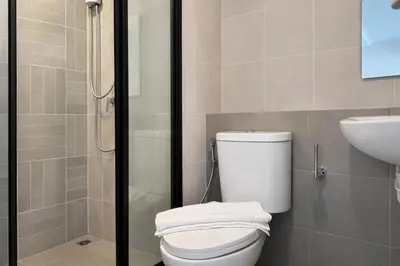 a bathroom with a toilet and a sink and a shower at Work & Travel in Kathu