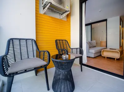 a room with two chairs and a table and a couch at Wyndham Garden 1220 Modern Studio Next to Naithon in Phuket Town
