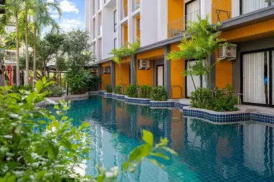 a swimming pool in the middle of a building at Wyndham Garden 1220 Modern Studio Next to Naithon in Phuket Town