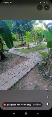 a picture of a stone pathway in a garden at Bang Riss kee Home Stay4 in Ko Yao Noi