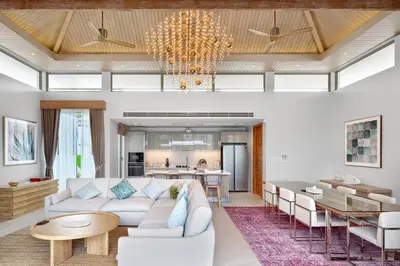 a living room with a couch and a table at Botanica Luxury Pool Villa Phuket in Thalang