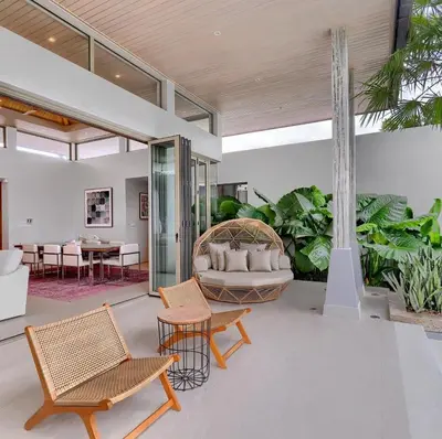 a living room with a couch and chairs and tables at Botanica Luxury Pool Villa Phuket in Thalang