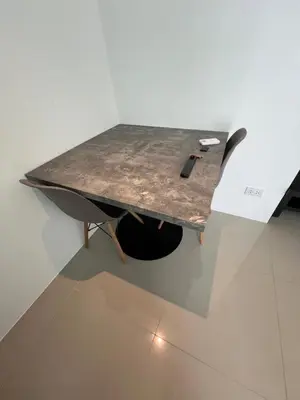 a table with a pen sitting on top of it at Utopia Central in Ban Ket Ho