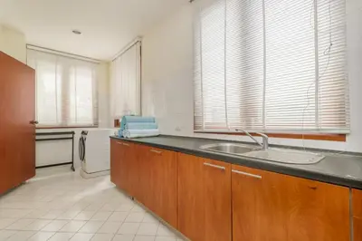 a kitchen with a sink and a counter top at Spacious Villa with Pool, Garden & Club facilities in Layan Beach