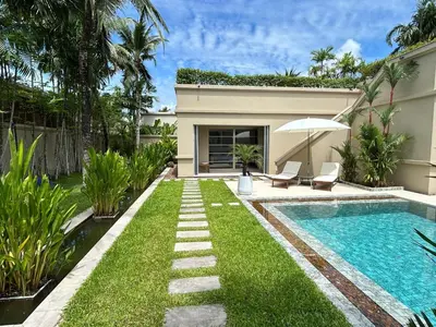 a backyard with a swimming pool and a house at Luxury Pool Villa Bangtao Phuket close to beach in Bang Tao Beach