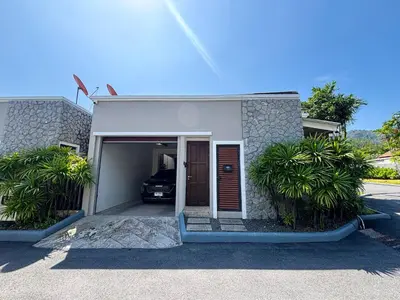a small house with a car in the garage at Tropical 2 BR Pool Villa - Baan Wana 177-15 in Koh Lone