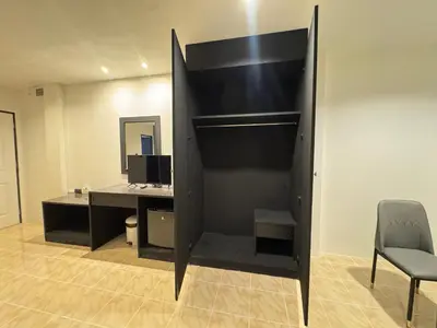 an empty office with a desk and a chair at Chapter 26 in Patong Beach