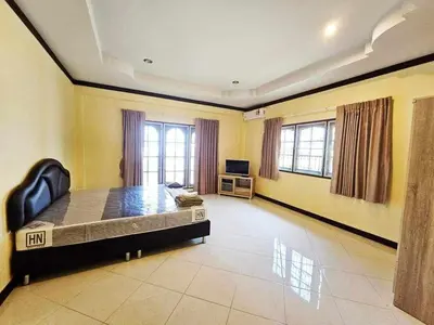 a large room with a bed and a television at Karon cottage Resort 2 Bedrooms Vl and BBQ in Karon Beach