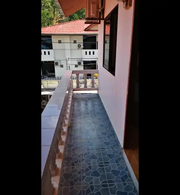 a view of a balcony with a tile floor at Tiger Nanai guest house in Patong Beach