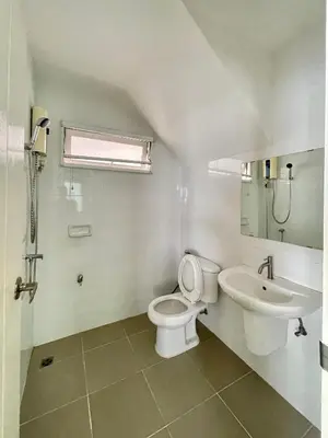 a bathroom with a toilet and a sink at Cozy Serene Home Quiet Garden for a Peaceful Stay in Phuket Town