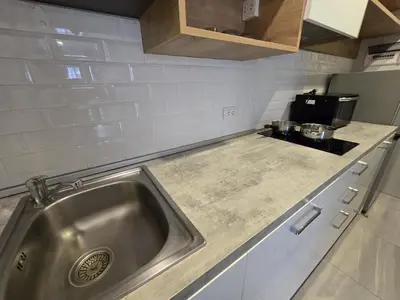 a kitchen with a sink and a stove at Urban Chill -1 Bedroom (T2-216) in Phuket Town