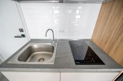a kitchen counter with a sink in a kitchen at Charming 1-Bed Apt (T3- 629) in Phuket Town