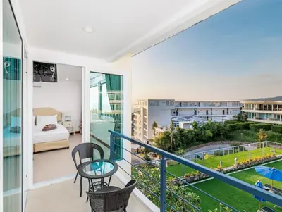 a balcony with a view of a hotel room at Karon Sea View 2 Bedrooms Apartment in Karon Beach