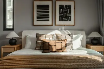 a bedroom with a bed with pillows on it at The Title Legendary Nature Flow in Bang Tao Beach
