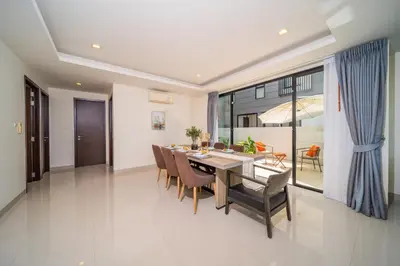 a dining room with a table and chairs at Laguna park 5bedroom private pool villa in Laguna Phuket