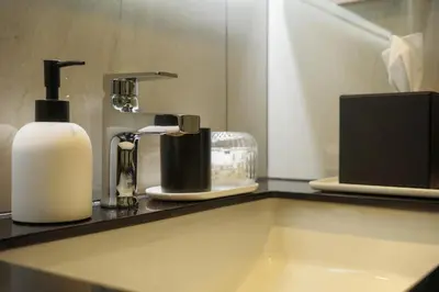 a bathroom counter with a soap dispenser and a sink at Bangtao The Title Legendary by Phuket Sabay Rent G201 in Bang Tao Beach