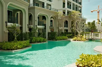 a swimming pool in front of a building at Bangtao The Title Legendary by Phuket Sabay Rent G201 in Bang Tao Beach