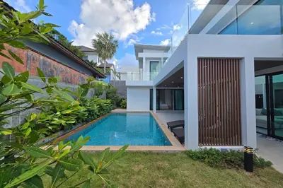 a swimming pool in the backyard of a house at 3BR Pool Villa JAAI in Ban Saiyuan (1)