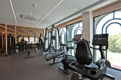 a gym with treadmills and ellipticals in a building at 1BR Apartment with Mountain View near Bang-Tao Beach CapitalPro in Bang Tao Beach